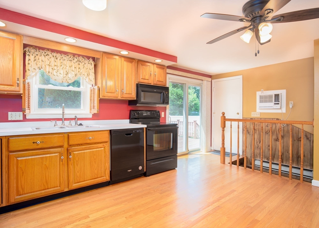 60 Saffron Circle Springfield, MA 01129 - Photo 5 of 37 a kitchen with stainless steel appliances sink and cabinets