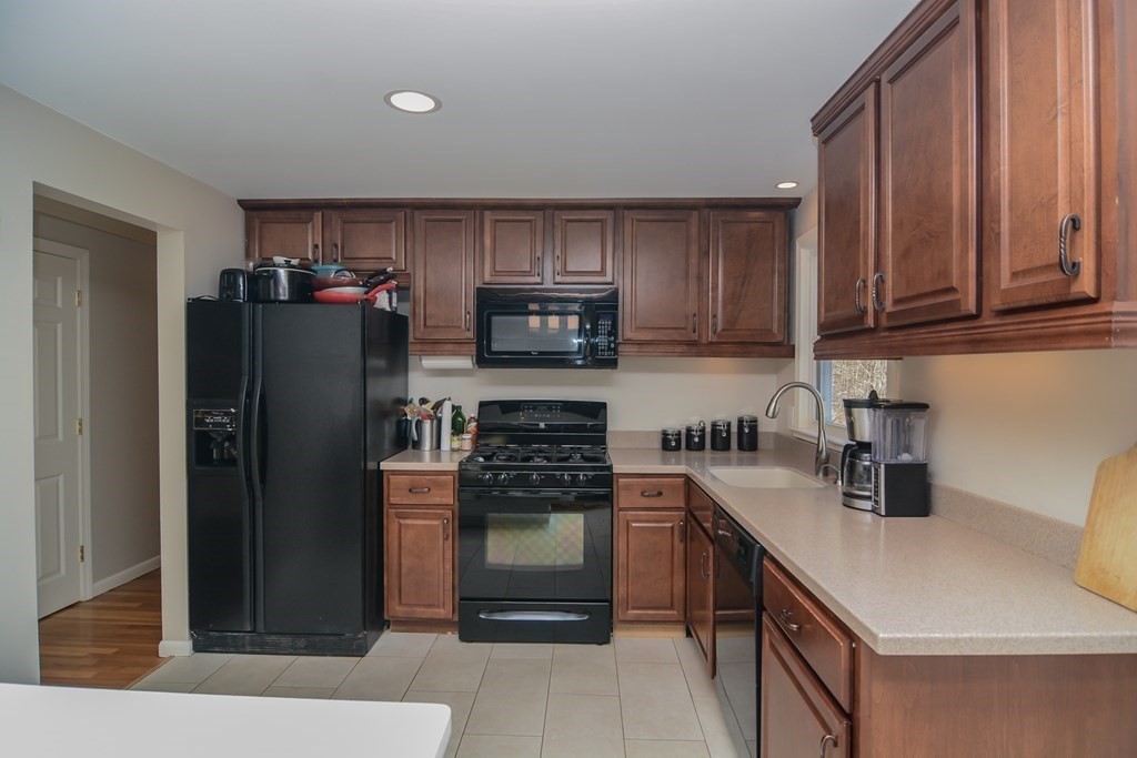 94 West Street Medway, MA 02053 - Photo 11 of 41 a kitchen with a refrigerator stove and sink