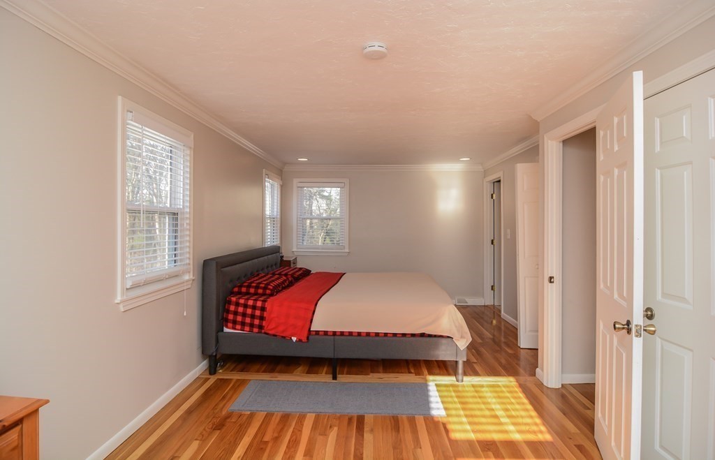 94 West Street Medway, MA 02053 - Photo 14 of 41 a spacious bedroom with a bed and window