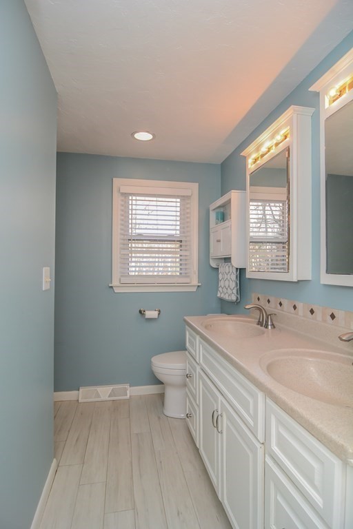 94 West Street Medway, MA 02053 - Photo 16 of 41 a spacious bathroom with a toilet sink and mirror
