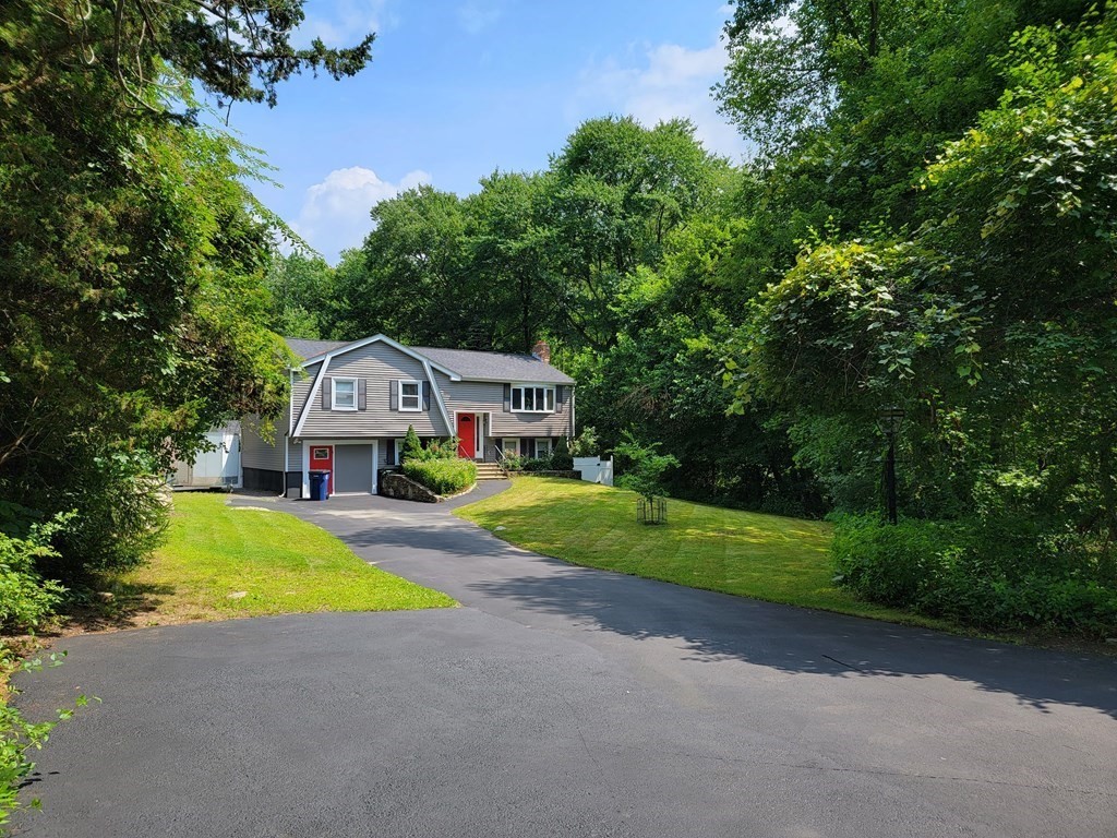 94 West Street Medway, MA 02053 - Photo 2 of 41 a front view of a house with yard and green space