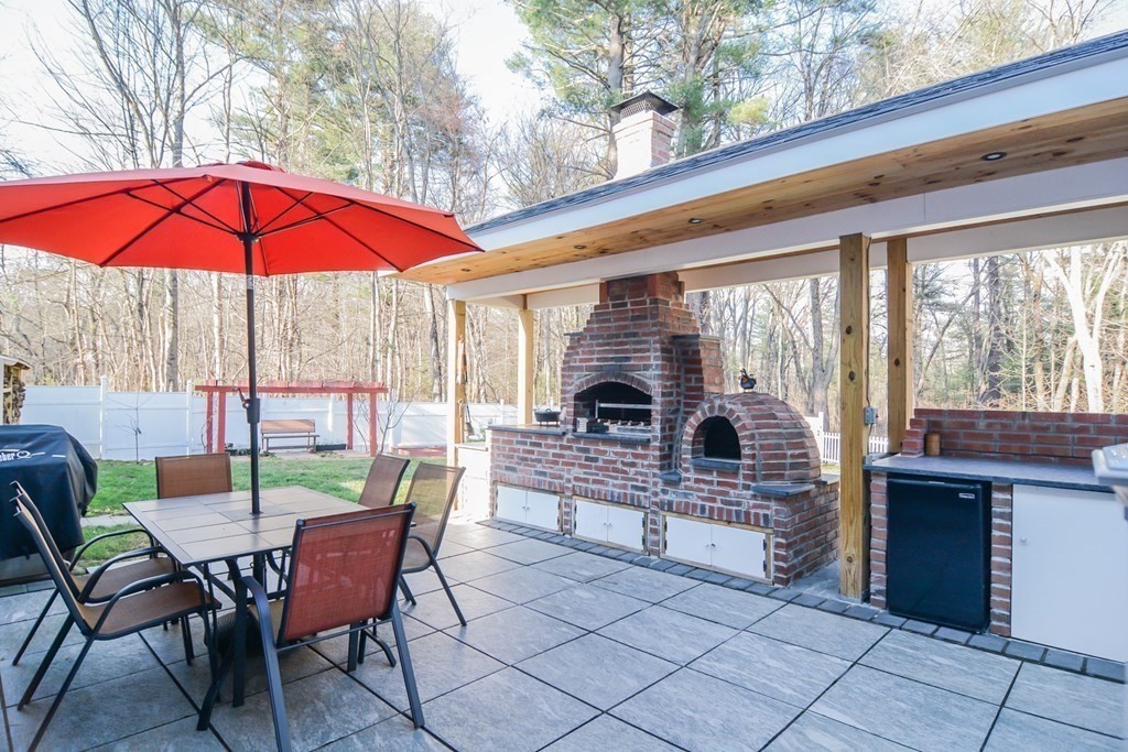 94 West Street Medway, MA 02053 - Photo 26 of 41 a view of a chair and table in the balcony