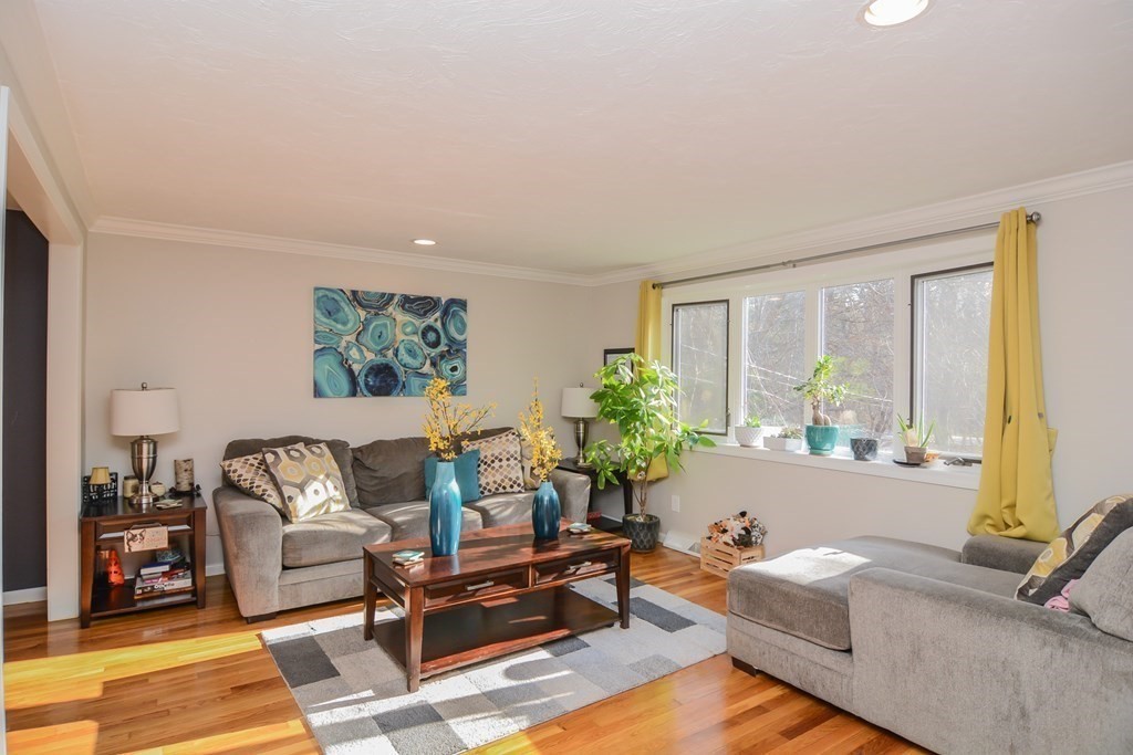 94 West Street Medway, MA 02053 - Photo 6 of 41 a living room with furniture and a large window