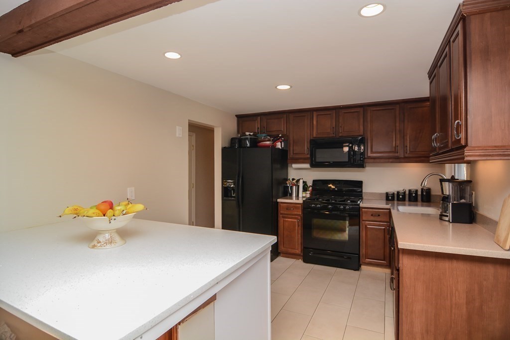 94 West Street Medway, MA 02053 - Photo 10 of 41 a kitchen with stainless steel appliances granite countertop a refrigerator sink and stove