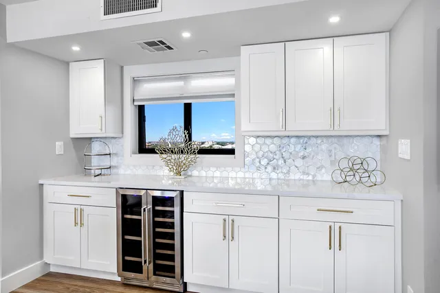 a kitchen with a sink and cabinets