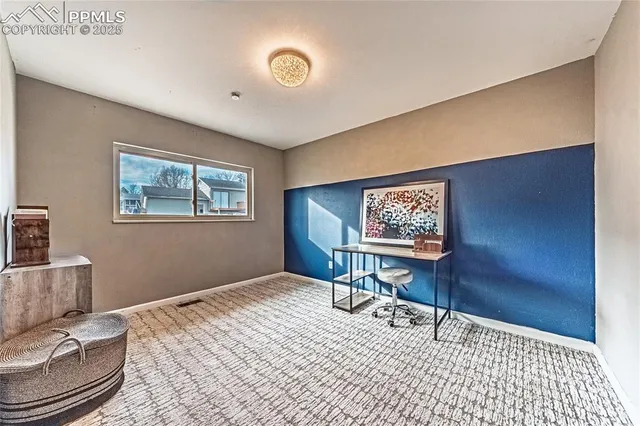 a view of a livingroom with furniture and window