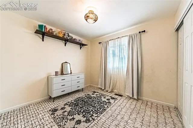 a bathroom with a window and a shower
