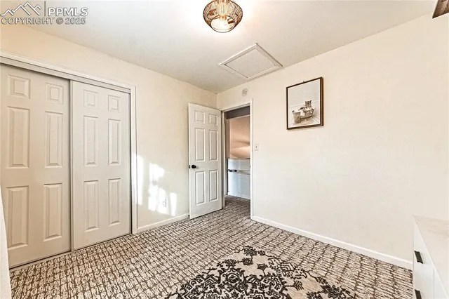 a view of a hallway with a window