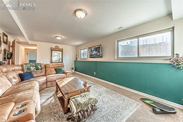 a living room with furniture and a window