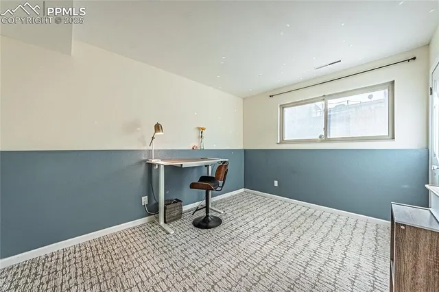 a workspace with furniture and window