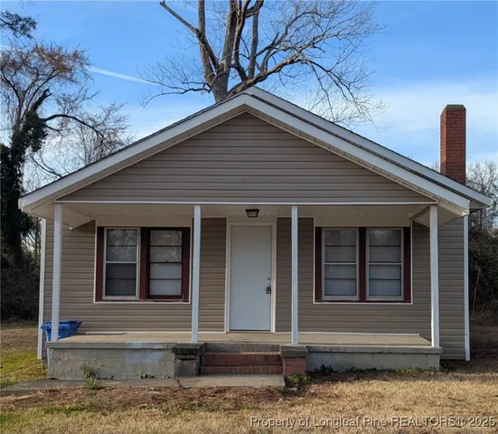 a front view of a house with stairs