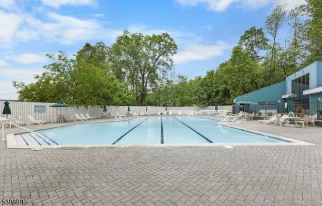 a view of a swimming pool with a patio