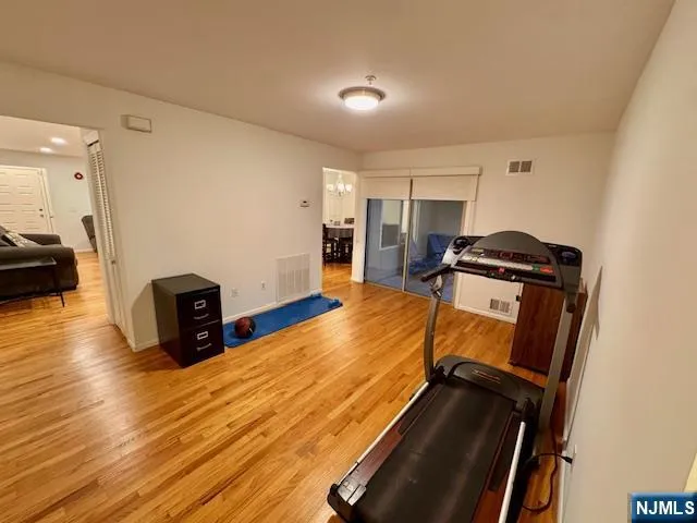 a room with wooden floor and furniture