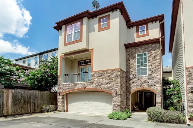 a front view of a house with a garage