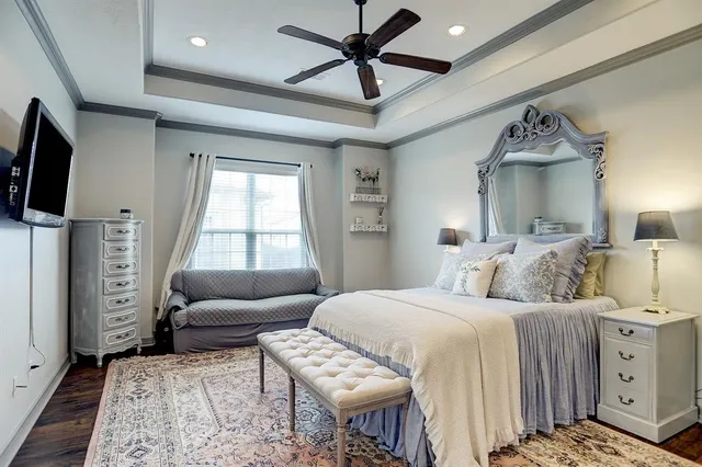 a bedroom with a bed and a couch