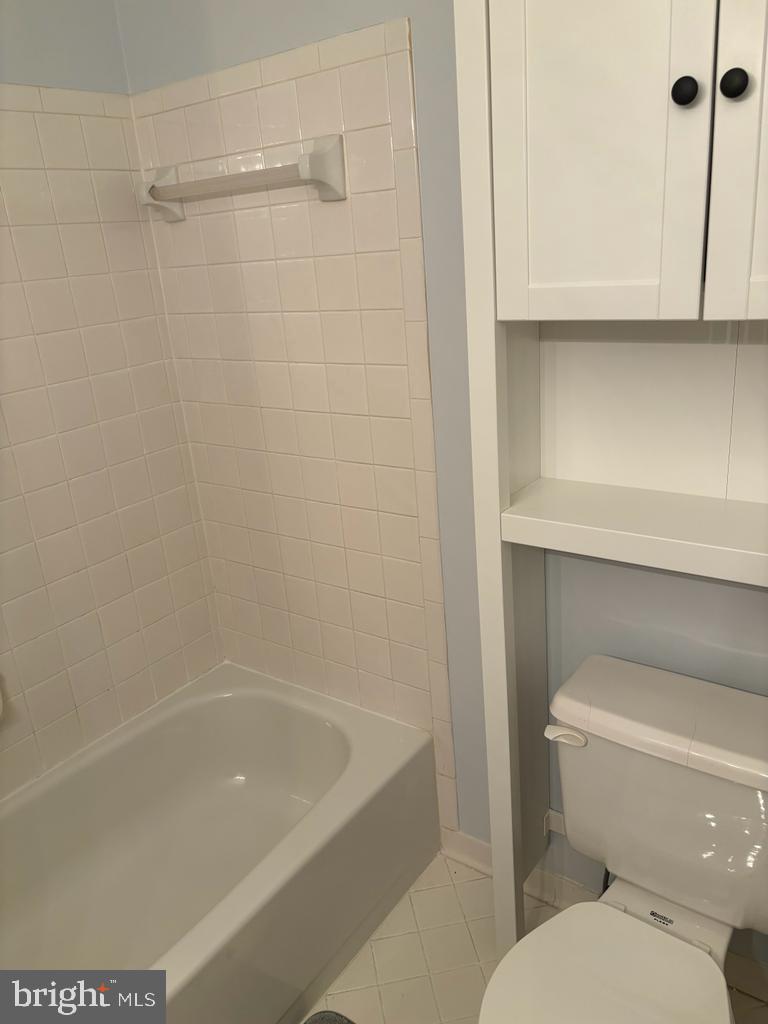 6803 Wild Rose Court Springfield, VA 22152 - Photo 37 of 49 a bathroom with a toilet and bathtub