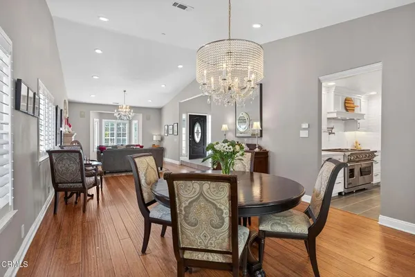a large kitchen with stainless steel appliances kitchen island granite countertop a sink and cabinets