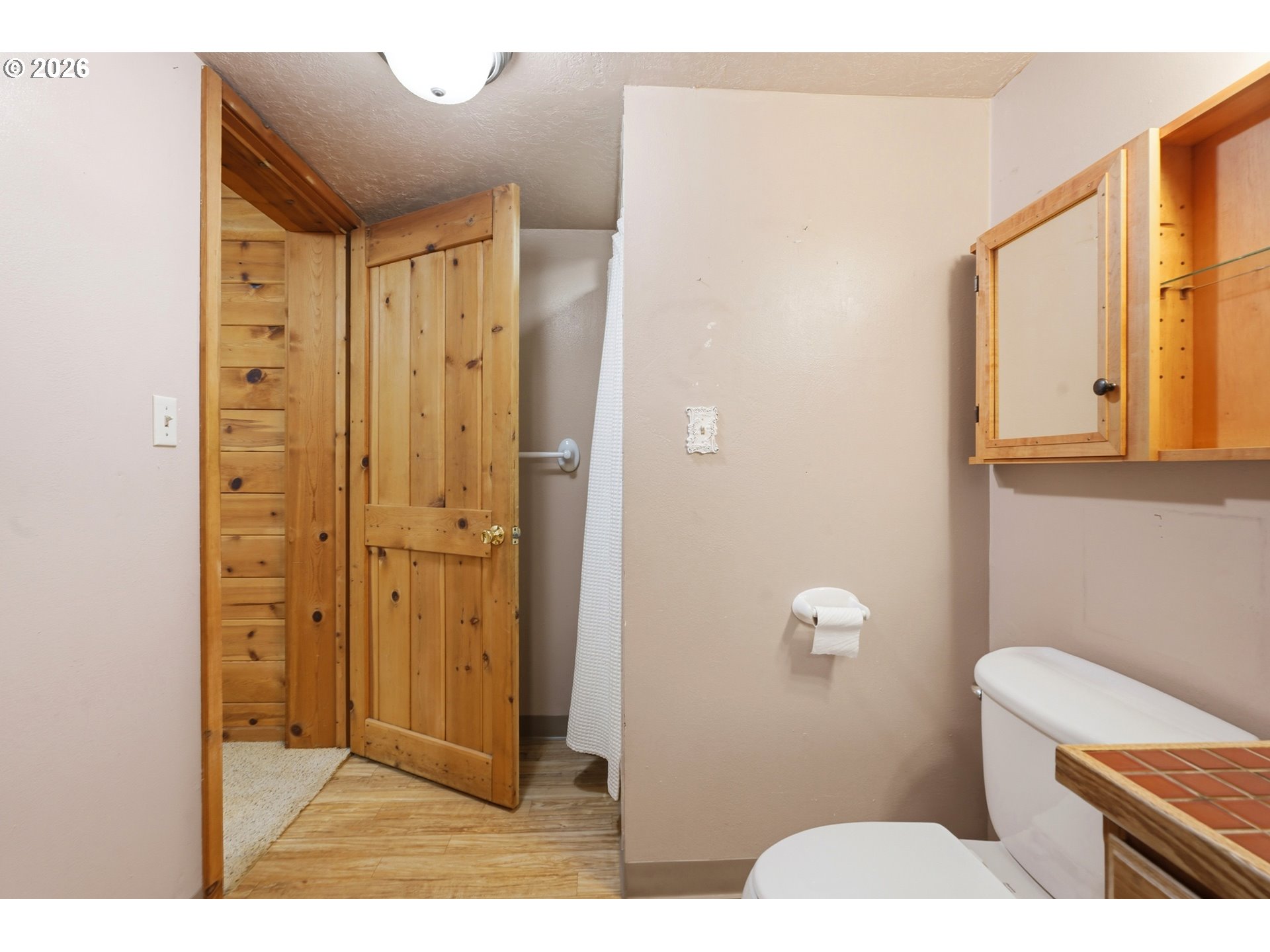 29870 South Dhooghe Road Colton, OR 97017 - Photo 29 of 48 a bathroom with a sink a toilet a mirror and shower