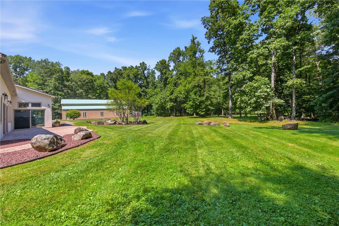 475 Crowthers Road Quakertown, PA 18951 - Photo 78 of 93 A spacious, verdant yard with mature trees offers a serene natural backdrop.