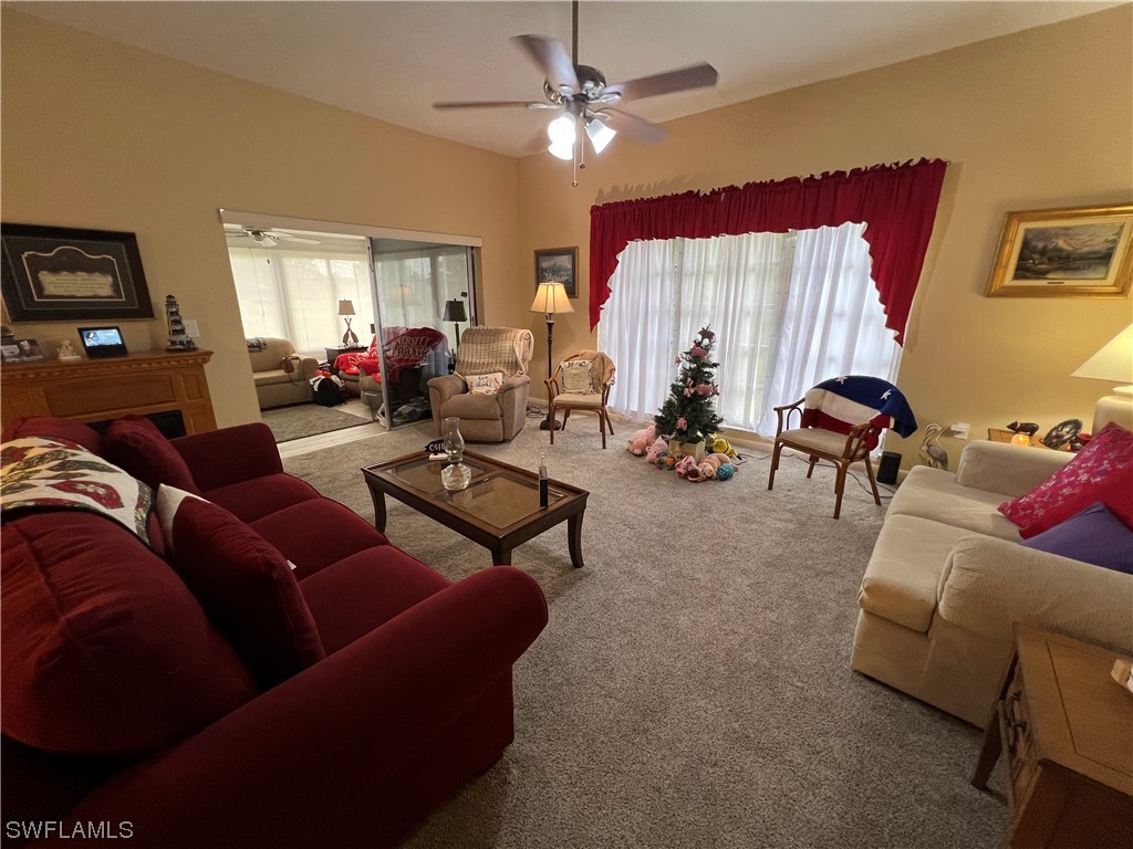 3 Regency Court Lehigh Acres, FL 33936 - Photo 16 of 27 a living room with furniture and a window