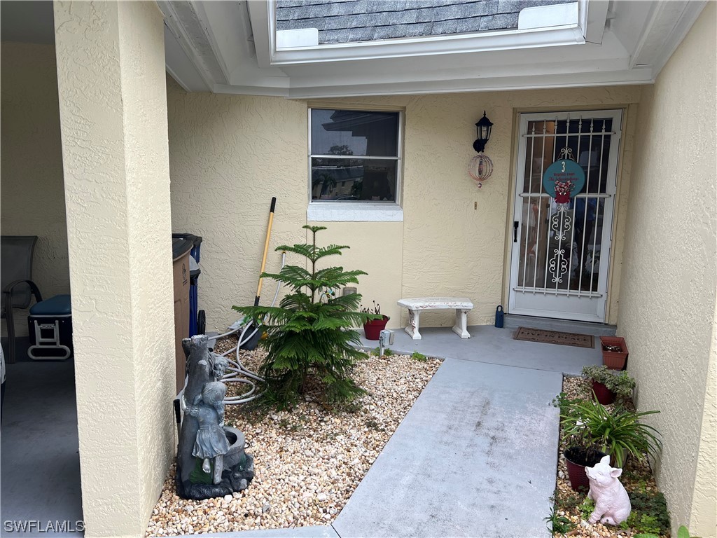 3 Regency Court Lehigh Acres, FL 33936 - Photo 2 of 27 a view of a entryway of the house