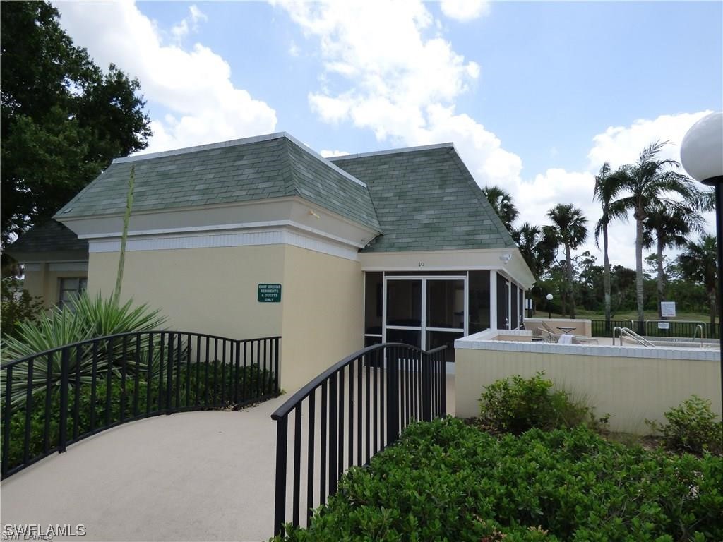 3 Regency Court Lehigh Acres, FL 33936 - Photo 25 of 27 a house view with a garden space