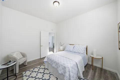 a bedroom with a bed and chair