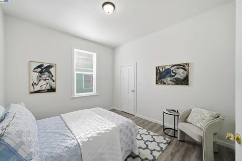 a bedroom with a bed and a chair