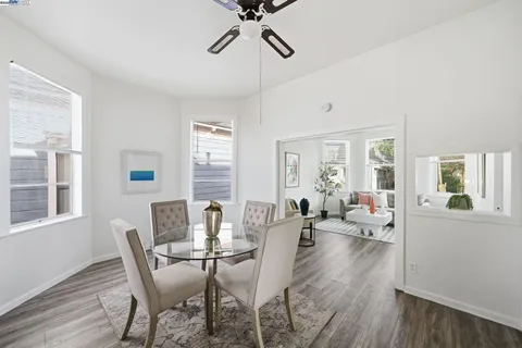 a view of a dining room with furniture window and wooden floor
