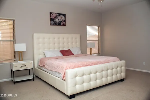 a bedroom with a bed and window