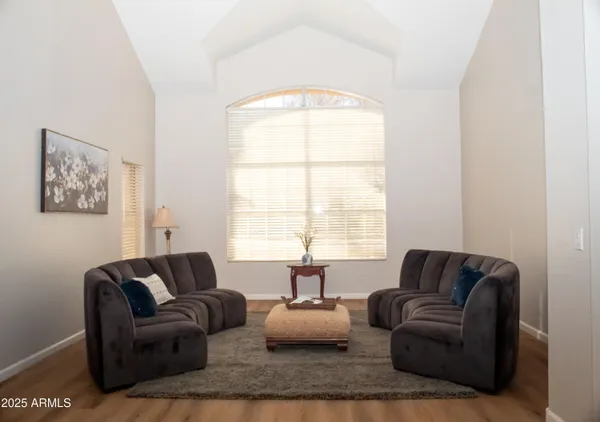 a living room with furniture and a window