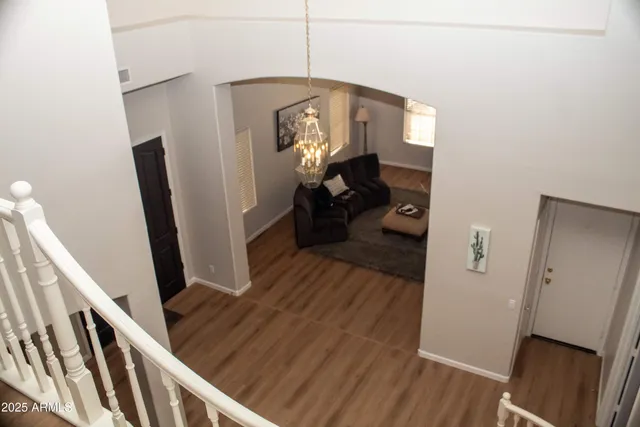 a view of a hallway view with wooden floor and staircase
