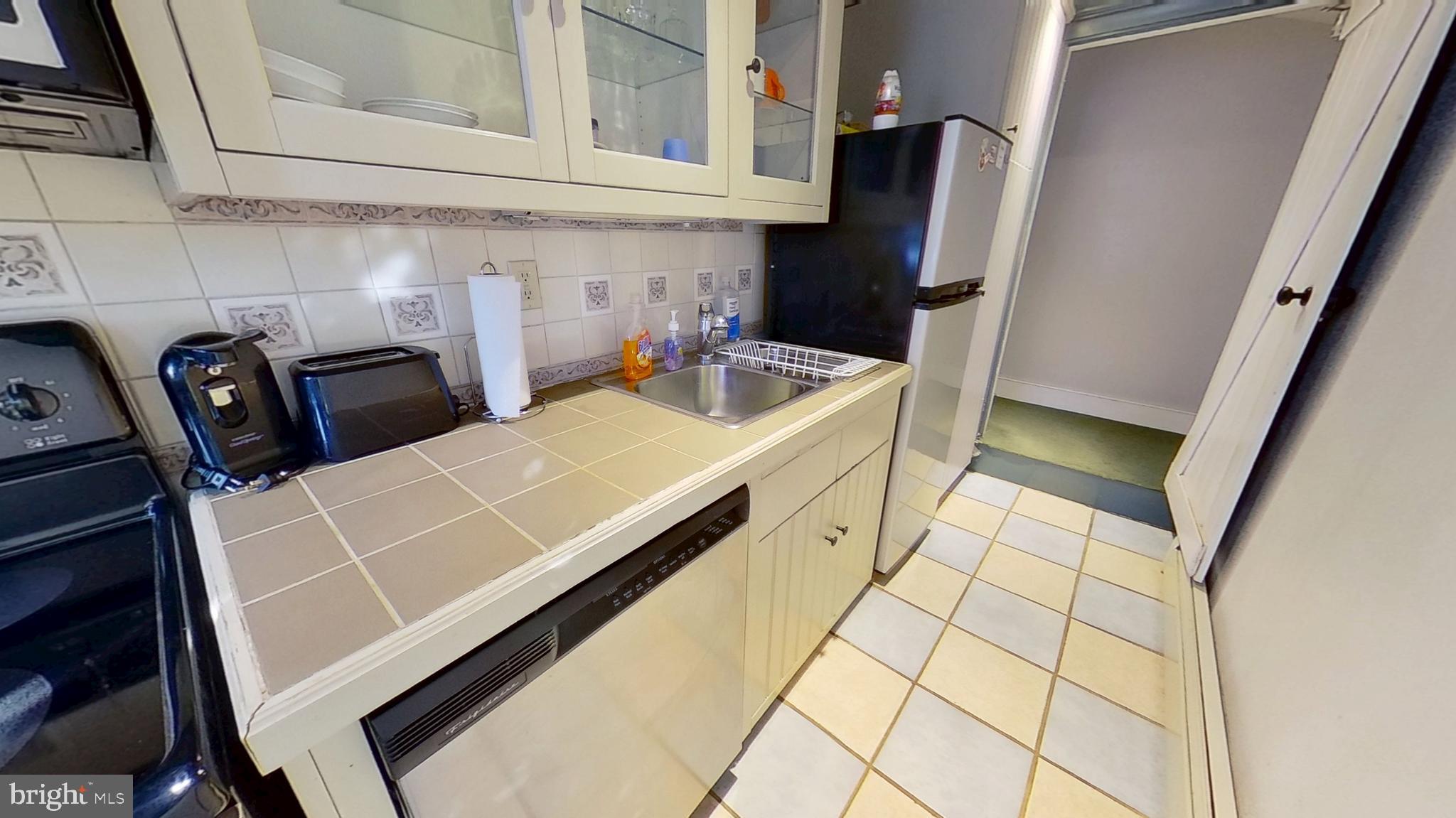 11525 High Point Road, Unit COTTAGE Felton, PA 17322 - Photo 2 of 7 a view of a kitchen with fridge and rack
