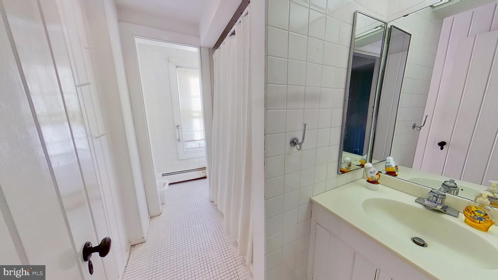 11525 High Point Road, Unit COTTAGE Felton, PA 17322 - Photo 5 of 7 a bathroom with a sink and a mirror