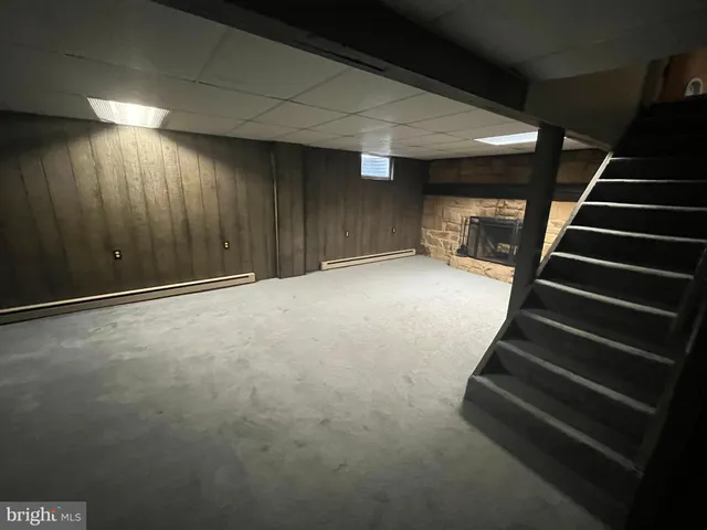 a view of an empty room with stairs