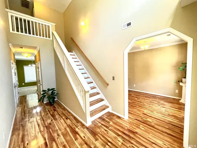 a view of an entryway with wooden floor