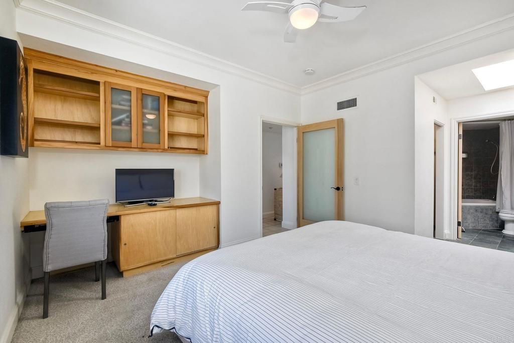 400 The Strand North, Unit 46 Oceanside, CA 92054 - Photo 12 of 25 a bedroom with a bed and dresser