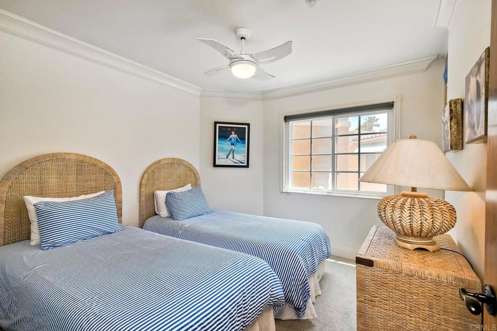 400 The Strand North, Unit 46 Oceanside, CA 92054 - Photo 15 of 25 a bedroom with bed and window