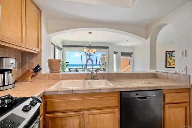 a kitchen with a sink and a refrigerator