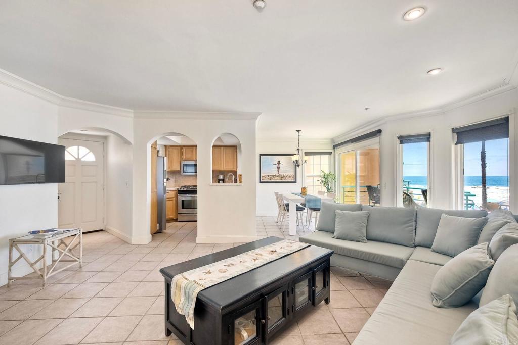 400 The Strand North, Unit 46 Oceanside, CA 92054 - Photo 5 of 25 a living room with furniture and wooden floor