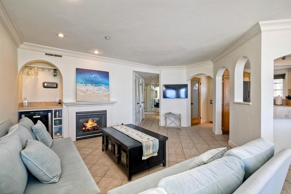 400 The Strand North, Unit 46 Oceanside, CA 92054 - Photo 8 of 25 a living room with furniture and a fireplace
