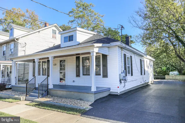 a front view of a house with a porch