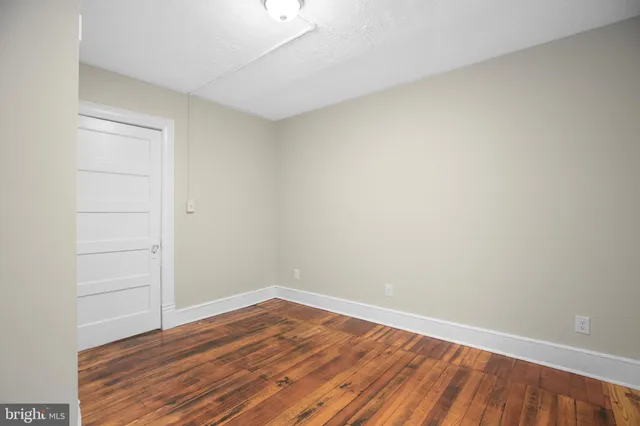 a view of wooden floor in an empty room