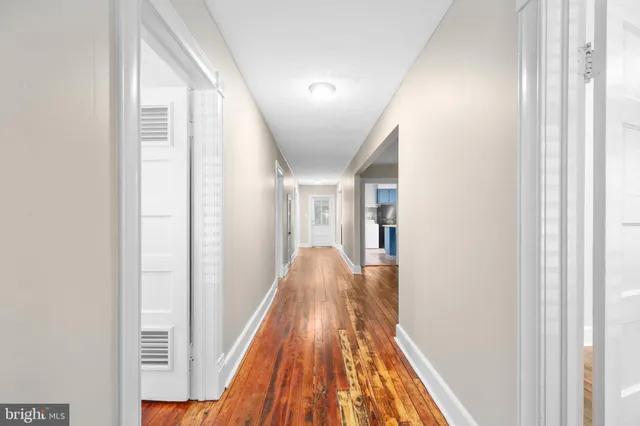 a view of gallery with wooden floor