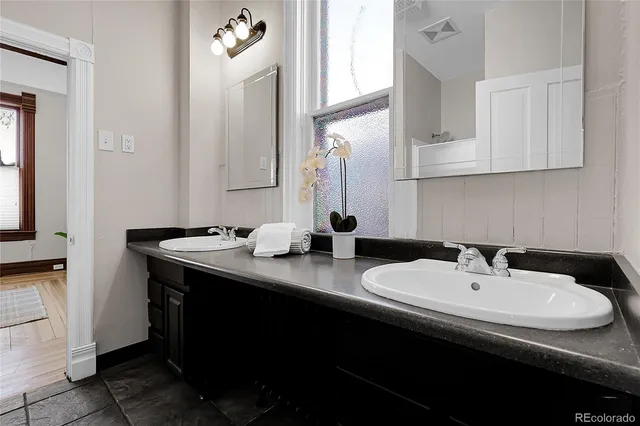 a bathroom with a sink and a mirror