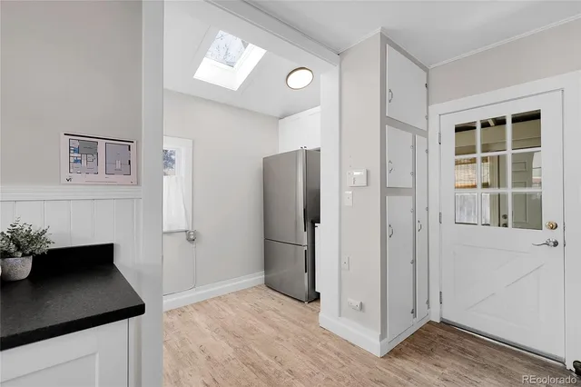 a kitchen with stainless steel appliances granite countertop a refrigerator and a sink