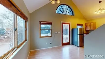 a living room with a bed and a window