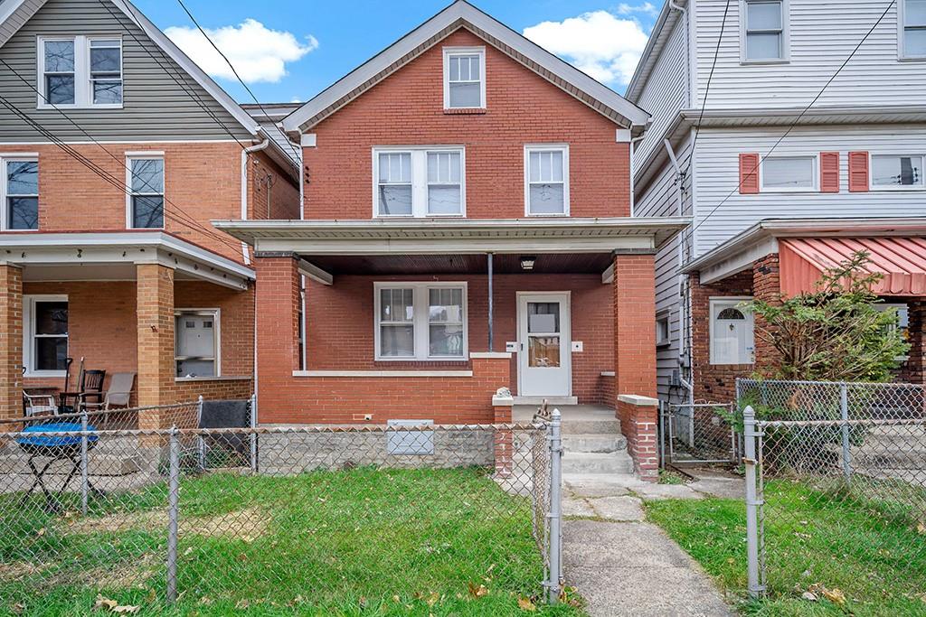 1167 Race Street McKees Rocks, PA 15136 - Photo 1 of 25 a front view of a house with garden