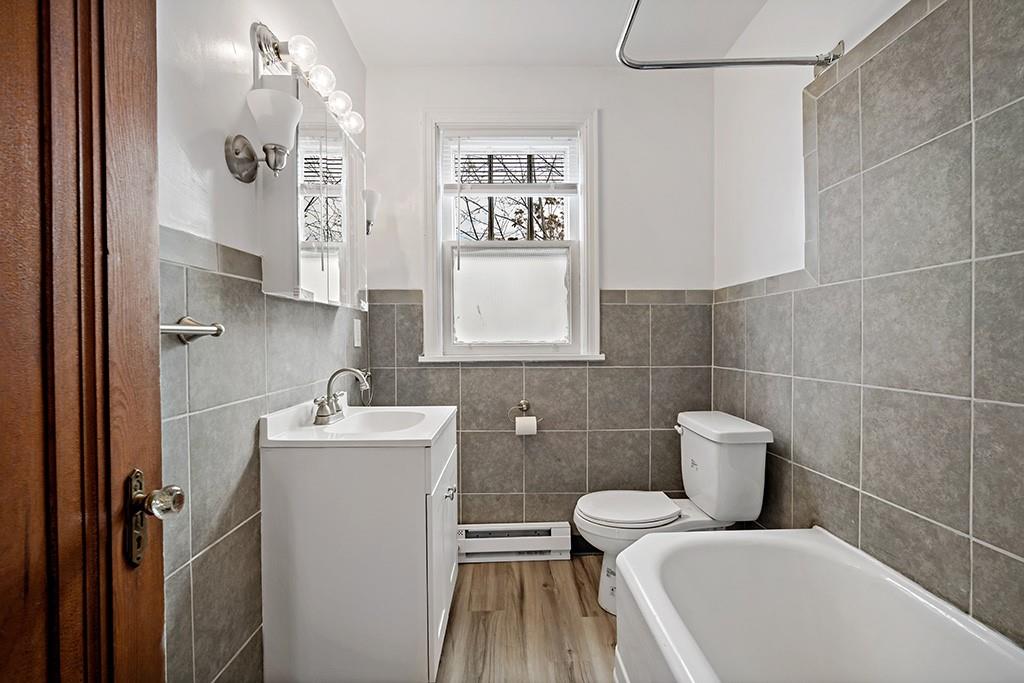 1167 Race Street McKees Rocks, PA 15136 - Photo 15 of 25 a bathroom with a toilet sink and mirror