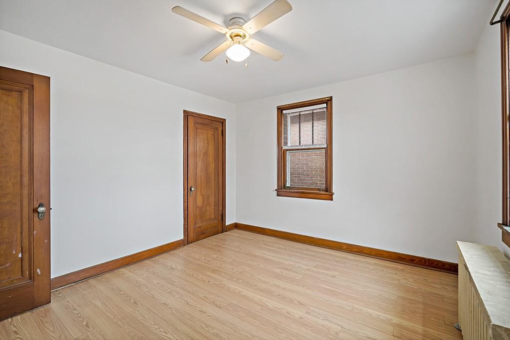 1167 Race Street McKees Rocks, PA 15136 - Photo 20 of 25 a view of an empty room with wooden floor and a window